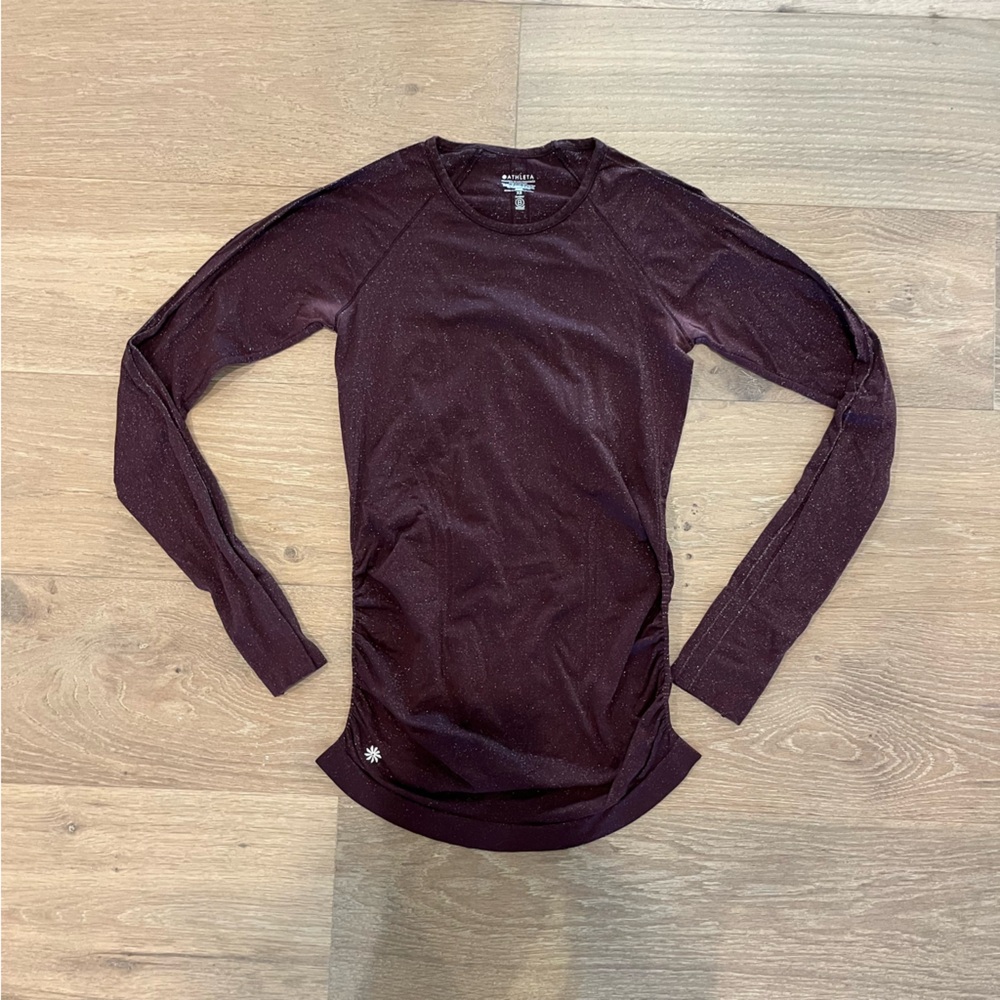 Athleta maroon sparkly long sleeve shirt with ruching down the side
